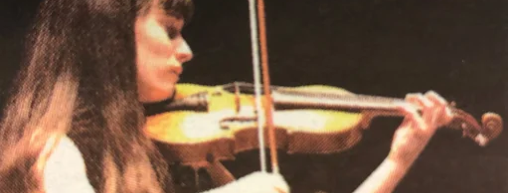 Image of Andrea Segar playing the violin in the first musical performance to take place at the Mondavi Center.