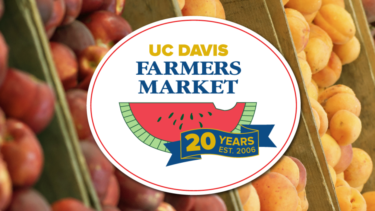 UC Davis Farmers Market 20th anniversary logo over photograph of peaches and apricots