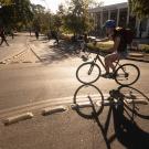 Student biking around traffic circle on the UC Davis campus.